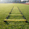 Soccer agility ladder laid out on green grass
